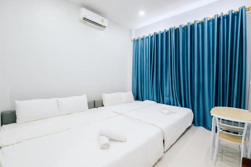 Ένα ή περισσότερα κρεβάτια σε δωμάτιο στο AABAN House 04