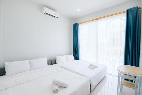 Ένα ή περισσότερα κρεβάτια σε δωμάτιο στο AABAN House 04