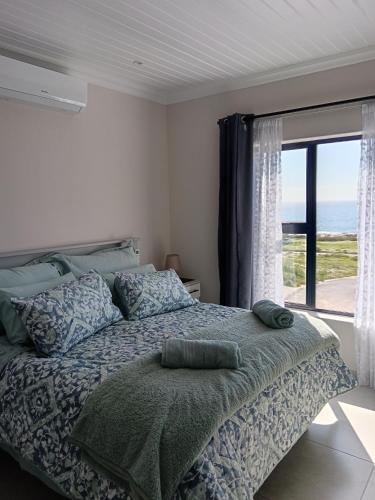 Postel nebo postele na pokoji v ubytování Russobietjie Luxury Self-catering House