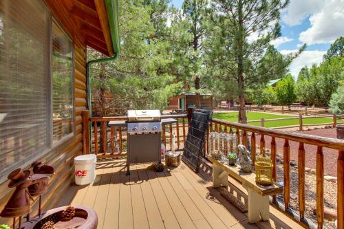 a patio with a grill on a wooden deck at Near Hiking Trails Heber-Overgaard Haven with Deck! in Overgaard
