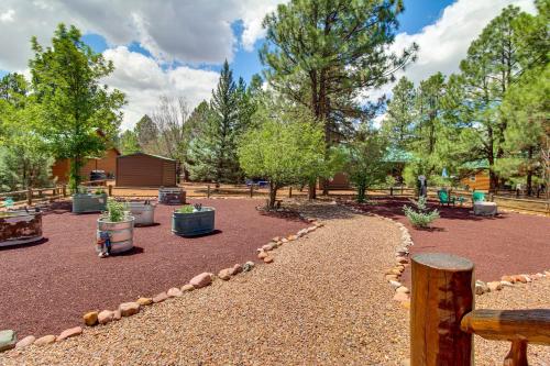 a park with benches and trees in the background at Near Hiking Trails Heber-Overgaard Haven with Deck! in Overgaard