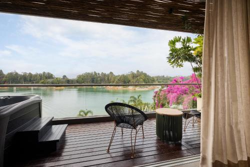 a balcony with a view of a lake at Tau House in Guatapé