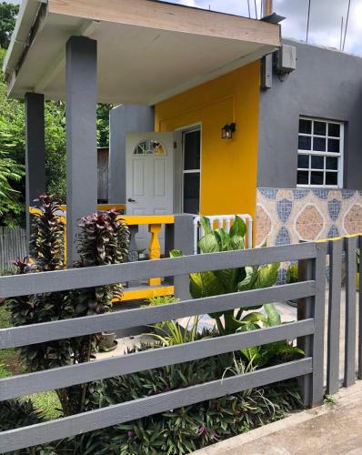 a house with a fence in front of it at River Valley View in Beaulieu