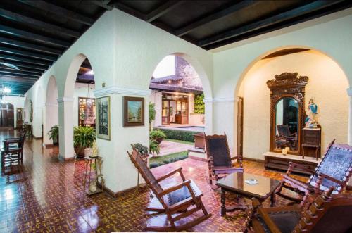 a living room with chairs and a table at Castillo San Miguel in Granada