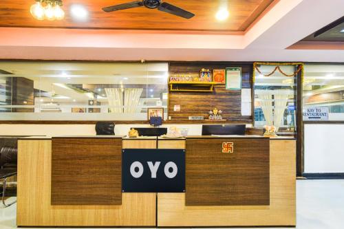 a restaurant with an ovation sign on a counter at Hotel O ROYAL KAKATIYA in Maula Ali