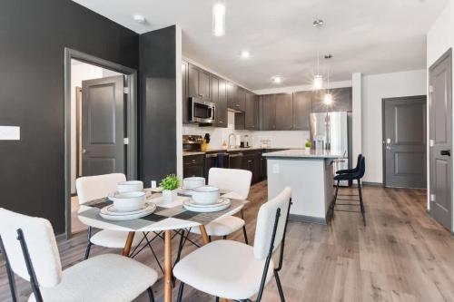 a kitchen and dining room with a table and chairs at Luxe King 2 Bedroom Suite in North Raleigh in Wake Forest