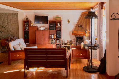 a living room with a couch and a table at Maimara Hotel in Huaraz