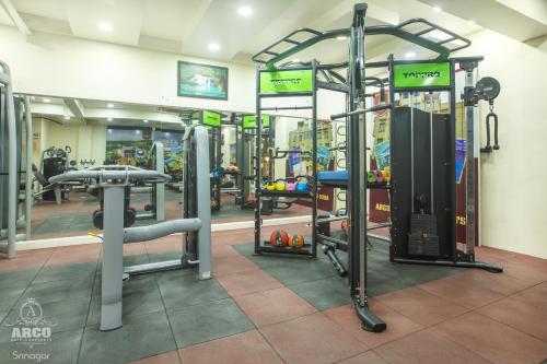 a gym with a bunch of equipment in a room at ARCO Hotels and Resorts Srinagar in Srinagar