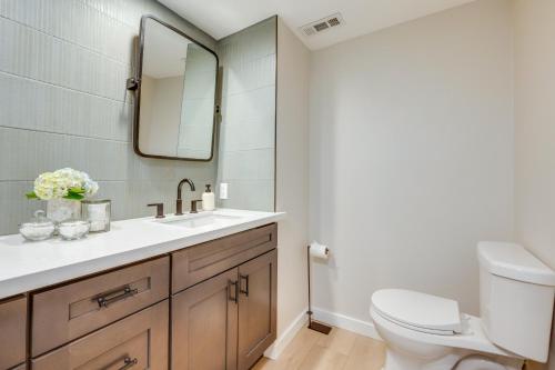 a bathroom with a sink and a toilet at Waterfront Gem with Boat Dock and Lift in Lakewood! in Lakewood