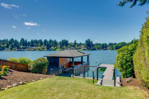 a gazebo on a dock on a lake at Waterfront Gem with Boat Dock and Lift in Lakewood! in Lakewood