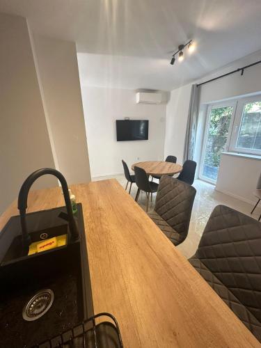 a kitchen and living room with a table and chairs at Eureka in Crikvenica
