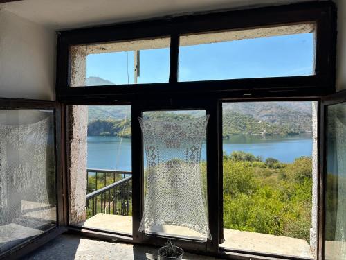 a window with a view of a body of water at Mark Toma Guesthouse 
