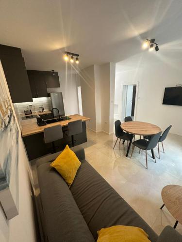 a living room with a couch and a table at Eureka in Crikvenica