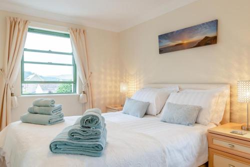 Ένα ή περισσότερα κρεβάτια σε δωμάτιο στο 32 St Brides Bay View Apts