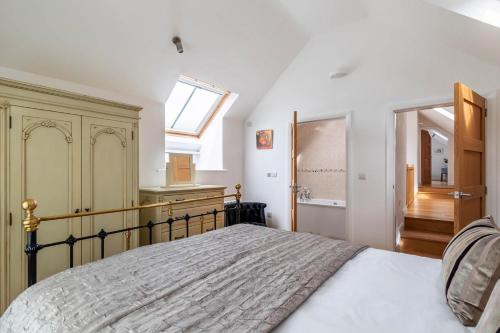 a bedroom with a bed and a skylight at Bryn Eithin in Derwen