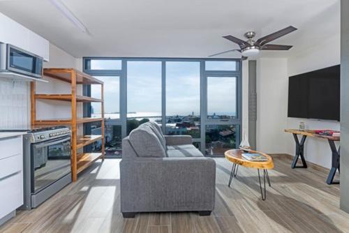 a living room with a couch and a table at Casco View Life in Panama City
