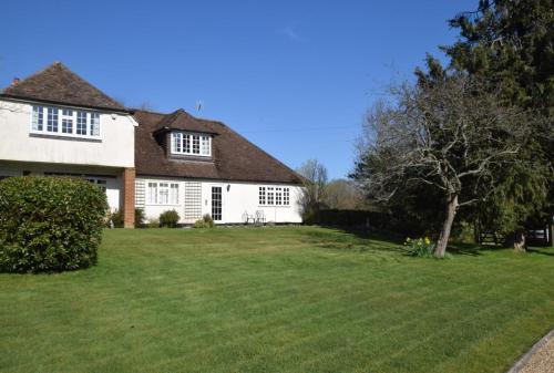 a large white house with a large yard at Readers Retreat in Saint Michaels