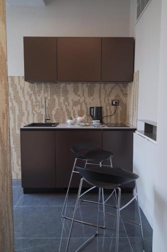 Η κουζίνα ή μικρή κουζίνα στο VBM SUITE & SPA Apartments