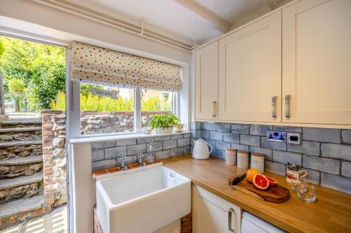 Køkken eller tekøkken på Primrose Cosy Cottage