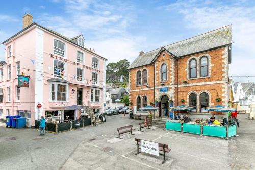 an empty street in a town with buildings at Mole End in Fowey