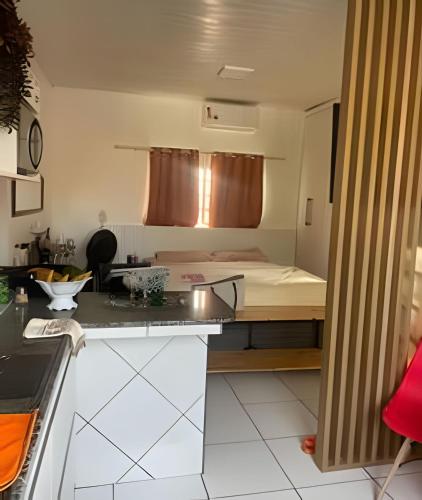 a small kitchen with a bed in a room at Orla de Macapá in Macapá