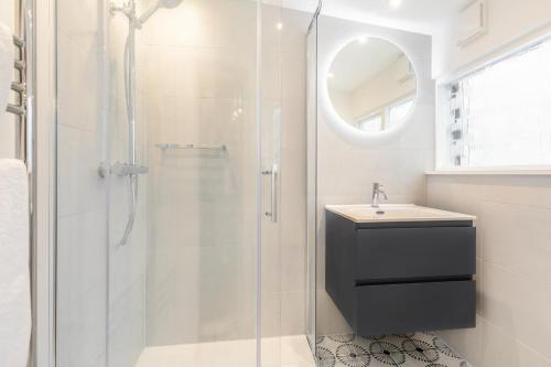a bathroom with a shower and a sink at Shell Cottage 10 St Peters Street in St Ives