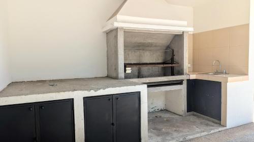 Kuchyň nebo kuchyňský kout v ubytování Habitaciones Deluxe La Casona de La Floresta