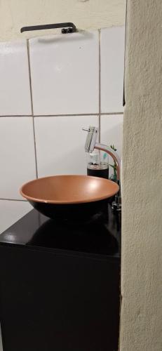 a wooden bowl sitting on top of a counter at Vilars154 - Cavaleiros e Lagoa in Macaé