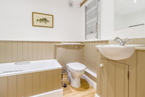 a bathroom with a sink and a toilet at Little Gable in Berrington