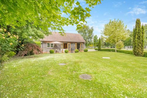 a home with a yard with a house at Little Gable in Berrington