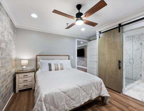 a bedroom with a bed and a ceiling fan at Carters Court Cozy Hideaway in Franklin