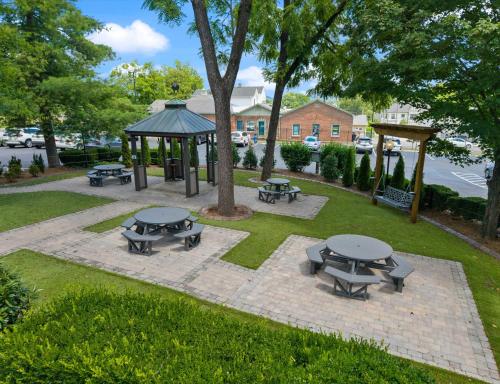 a park with picnic tables and a gazebo at Carters Court Cozy Hideaway in Franklin