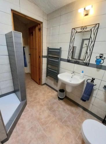 a bathroom with a sink and a mirror at Casa Moya in Alcalá la Real