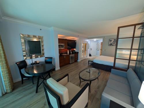 a hotel room with a bed and a living room at Jet Luxury Elite at The Signature in Las Vegas