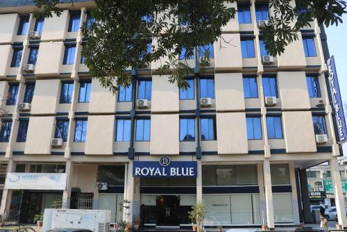 a building with a sign for a royal blue at Royal Blue Hotel in Islamabad