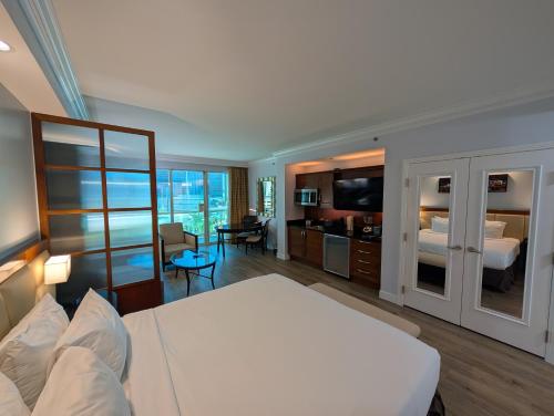 a bedroom with a bed and a living room at Jet Luxury Elite at The Signature in Las Vegas