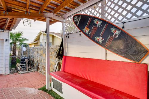 a skateboard sitting on top of a red bench at 13 Mi to Downtown El Paso Home with Game Room and Bar in El Paso