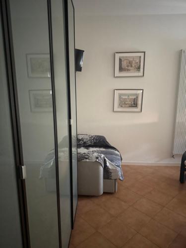 a bedroom with a bed and a sliding glass door at ApartmentsPadova in Padova