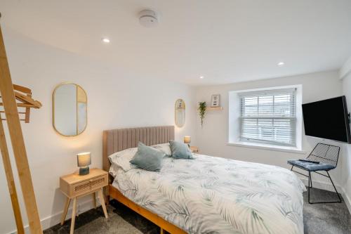 Voodi või voodid majutusasutuse Hardy Hideaway toas