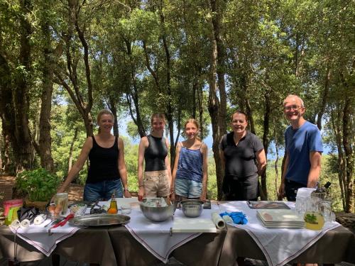 a group of people standing in front of a table at Villa Experience - Relais Il Termine Elba in Rio Marina