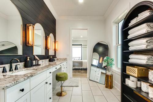a bathroom with a sink and a mirror at Luxury Beachfront Living! Epic Ocean Springs Home in Ocean Springs