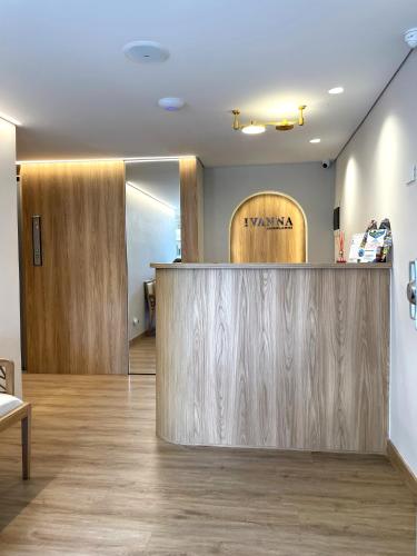 a salon with a wooden counter in a room at Ivanna Jumar ApartaHotel in Medellín