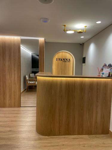 a hotel lobby with ahiarmaarma sign on the wall at Ivanna Jumar ApartaHotel in Medellín