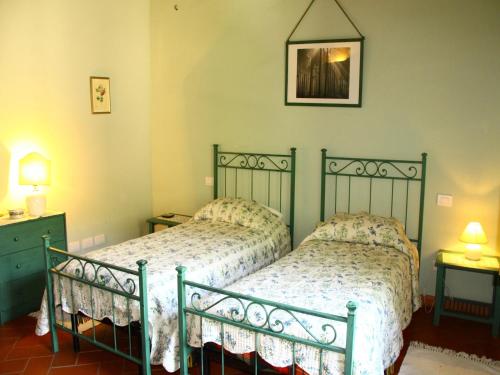Ένα ή περισσότερα κρεβάτια σε δωμάτιο στο Idyllic Tuscan Hideaway with Pool and spa