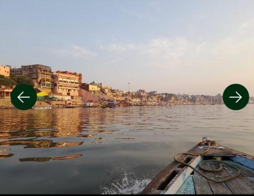 a boat on a river with two arrows on the water at Sawaria Residency in Varanasi