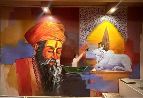a painting of a man in a boat in the water at Sawaria Residency in Varanasi