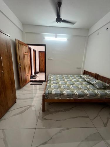 Katil atau katil-katil dalam bilik di Gopurathingal studio Apartment Bethel