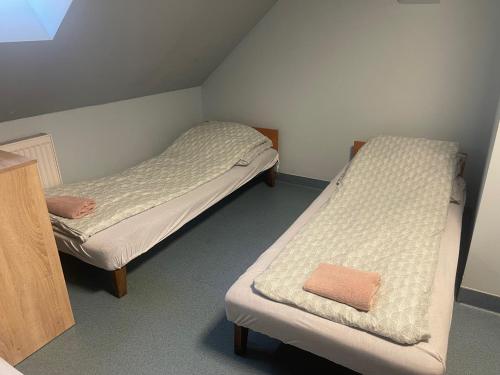 a room with two beds in a room at Lawendowa Przystań - Dolina Baryczy in Ujeździec Mały