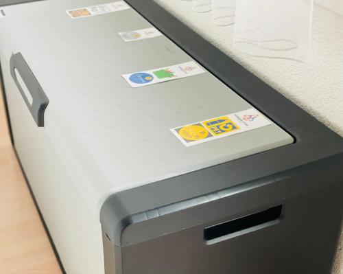 a refrigerator with magnets on the side of it at Winner Star RVSVN Ferien Wohnung in Safenwil