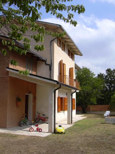 a house with two bikes parked outside of it at Alloggio agrituristico Agripark in Armento